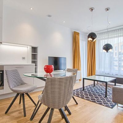 two-chairs-with-glass-table-on-living-room two-chairs-with-glass-table-on-living-room